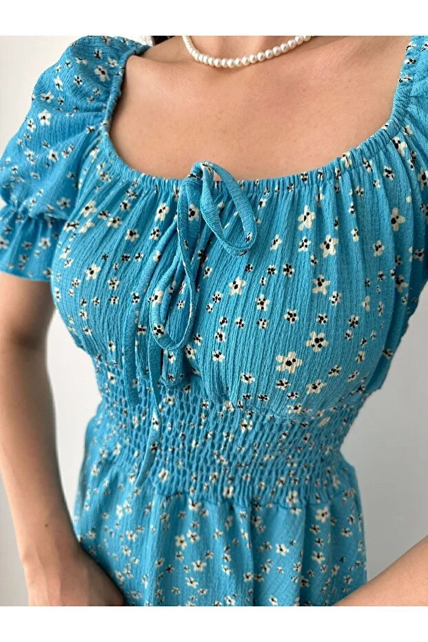 Kayık Yaka Çiçek Desenli Bürümcük Mini Elbise – Mavi